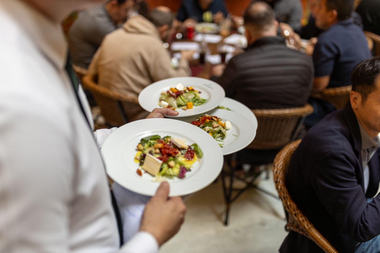 A waiter serving the table